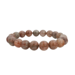 Bracelet flexible en pierre naturelle fait de perles rondes et lisses de quartz clair de 10-11mm avec des inclusions de rutile de cuivre mixte.