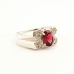 925 sterling silver design ring featuring an original oval cut rubellite tourmaline and diamonds.