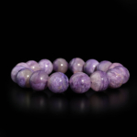 Bracciale flessibile in pietra naturale realizzato con grandi perle rotonde e lisce di charoite viola venata di qualita 6A+.