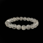 Bracciale flessibile in pietra naturale realizzato con perle rotonde e lisce di quarzo trasparente da 8-9mm con inclusioni di rutile nero taglienti di qualita 6A+.