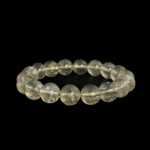 Bracelet flexible en pierre naturelle fait de perles rondes et lisses de quartz clair de 11-12mm avec des inclusions de rutile vert.