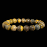 Bracciale flessibile in pietra naturale realizzato con perle rotonde e lisce di diaspro bumblebee da 9-10mm con bande gialle e nere.