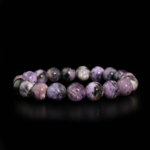 Bracciale flessibile in pietra naturale realizzato con perle rotonde e lisce di charoite viola venata di qualita 5A+.