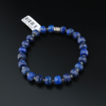 Bracciale in pietra naturale di lapislazzuli originale blu scuro taglio a rondelle sfaccettate con macchie di pirite dorata.