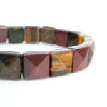 Flexibles Rolex-Schliff-Natursteinarmband aus originalen Tigerauge-Steinen in Gold-, Rot- und Blautönen.