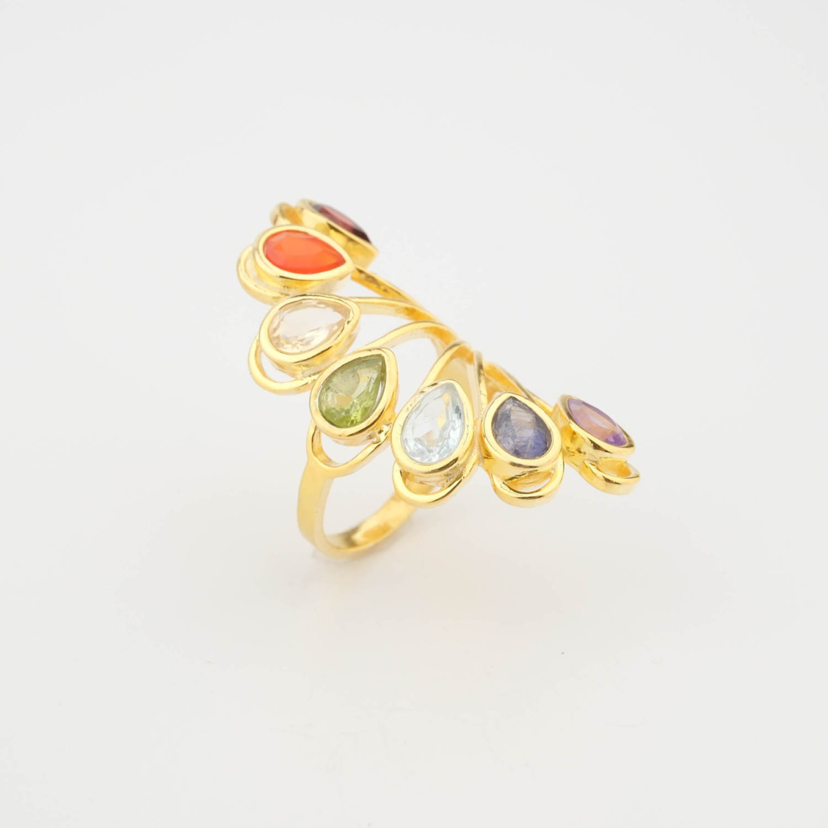 A luxury women's statement ring featuring original multi-gemstones including amethyst, sapphire, blue topaz, peridot, citrine, carnelian, and garnet on a gold-plated 925 sterling silver fan band.