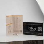 A luxury solitaire designer ring featuring a certified 1.5 carat D color VVS1 round brilliant moissanite gemstone set in a four-prong 925 sterling silver band with a GRA certificate.