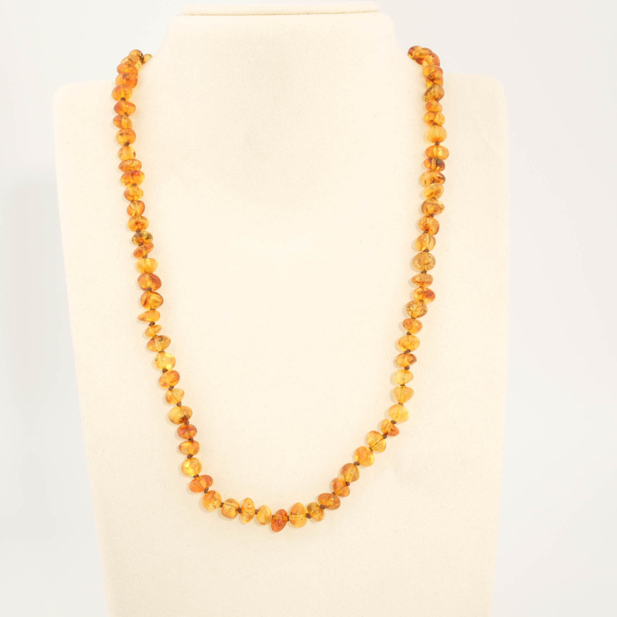 A certified original Baltic amber gemstone adult necklace (13-15g, 50-55cm) featuring smooth honey amber beads.