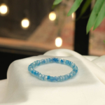 A luxury statement gemstone bracelet featuring original 4x6.5mm 8A+ VIP grade faceted aquamarine rondelle beads on a stretch band.