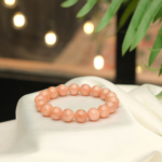 A stylish gemstone statement bracelet featuring original 11-12mm 4A+ grade sunstone round beads on a stretch band.