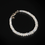 A delicate designer bracelet featuring original 4-6mm 6A+ grade faceted moonstone rondelle beads set in 925 sterling silver.