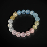 A luxury statement gemstone bracelet featuring original 11-12mm 7A+ grade pastel morganite round beads on a stretch band.