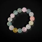 A luxury statement gemstone bracelet featuring original 15-16mm 7A+ grade pastel morganite round beads on a stretch band.