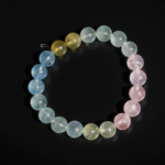 A luxury statement gemstone bracelet featuring original 9-10mm 7A+ grade pastel morganite round beads on a stretch band.