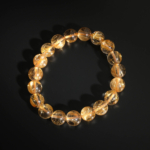 A luxury statement gemstone bracelet featuring original 10.23-10.28mm 10A+ VIP grade golden rutilated quartz round beads with international certification.