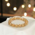 Bracelet de luxe orné de perles rondes de 10,22-10,28mm en quartz rutile doré naturel original de qualité 10A+ VIP certifié.