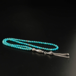 Rosario da 99 grani in turchese naturale (4mm) con nappa e elementi in argento 925.