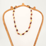 Collier bébé certifié en ambre baltique naturel (30-35cm, 4-7g) avec perles lisses ambrées et cognac.