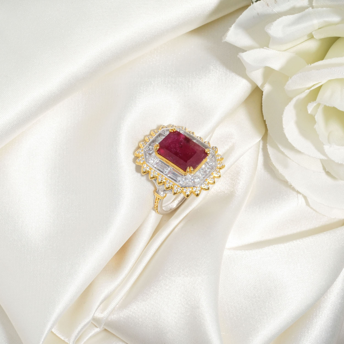 A luxury statement ring featuring an original 7.5ct rectangular ruby gemstone surrounded by Swarovski crystals in 925 sterling silver.