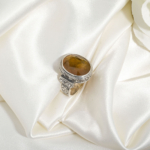 A luxury handmade statement ring featuring an original 12.45ct yellow sapphire gemstone set in 925 sterling silver with engraved details.