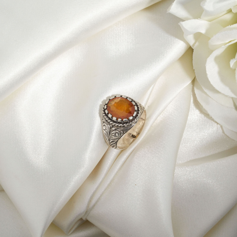 A luxury handmade statement ring featuring an original 6.80ct oval yellow sapphire gemstone set in engraved 925 sterling silver.