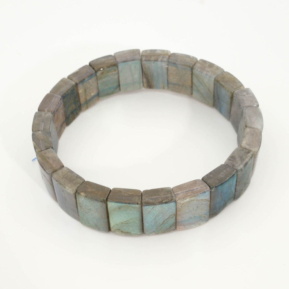 A luxury men's statement bracelet featuring original 6A+ grade rolex style rectangular cut labradorite gemstones with intense blue labradorescence.