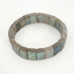 A luxury men's statement bracelet featuring original 6A+ grade rolex style rectangular cut labradorite gemstones with intense blue labradorescence.