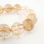 Bracciale di design di lusso ornato con sfere da 16,01-16,03mm di gemma di quarzo rutilato oro originale 10A+ VIP con certificato.