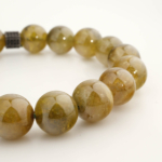 Bracelet orné de perles rondes de 10-11mm en péridot naturelle originale de qualité 6A+ et intercalaire en argent.