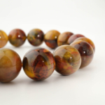 Bracelet de prestige orné de perles rondes de 12-13mm en pietersite jaune et rouge naturelle originale de qualité 5A+.