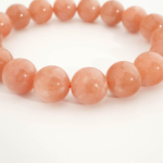 Bracciale di design ornato con sfere da 11-12mm di gema di pietra del sole originale 4A+ con sfumature arancioni.