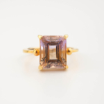 A luxury women's statement ring featuring an original emerald cut ametrine gemstone set in gold-plated 925 sterling silver with sphere details.