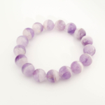 A stylish gemstone statement bracelet featuring large original 12-13mm two-tone purple and white amethyst round beads.