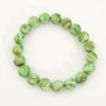 A luxury statement gemstone bracelet featuring original 10-11mm 5A+ grade green variscite round beads on a stretch band.