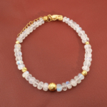 A delicate gold-plated designer bracelet featuring original 4-6mm 6A+ grade faceted moonstone rondelle beads set in 925 sterling silver.