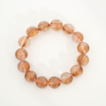 A luxury statement gemstone bracelet featuring original 14.54-14.56mm 10A+ VIP grade copper golden rutilated quartz round beads with certification.