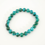 A stylish gemstone statement bracelet featuring original 8-9mm 6A+ grade malachite chrysocolla round beads on a stretch band.