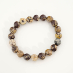 A stylish gemstone statement bracelet featuring original 10-11mm chocolate jasper round beads on a stretch band.