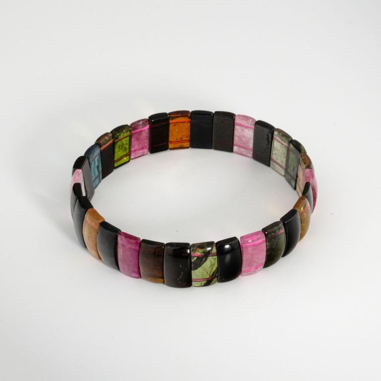 An 8A+ VIP quality natural multi tourmaline gemstone rolex style stretch bracelet featuring colorful rectangular beads.