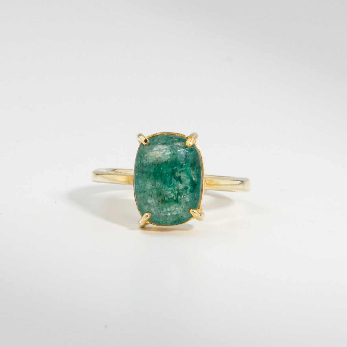 A 925 sterling silver gold-plated women's solitaire ring featuring a 3.05 ct natural oval raw emerald beryl gemstone.