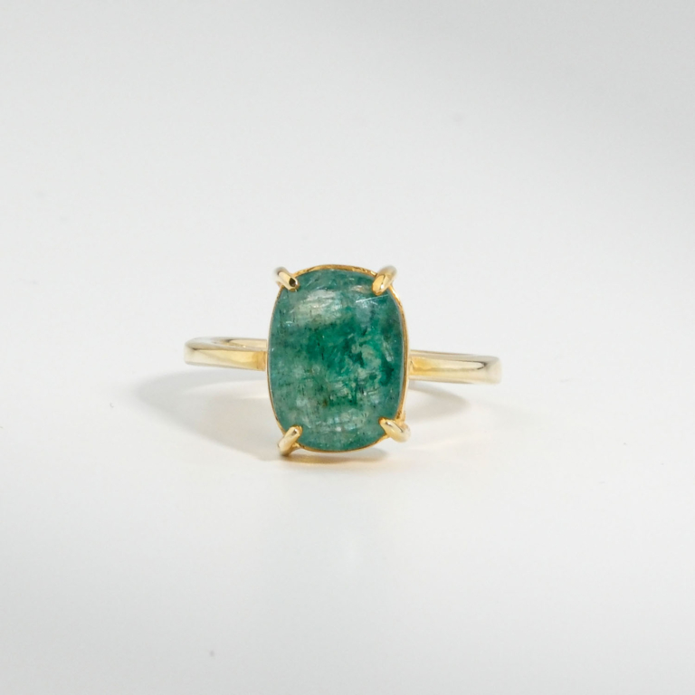 A 925 sterling silver gold-plated women's solitaire ring featuring a 3.05 ct natural oval raw emerald beryl gemstone.