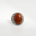 A 925 sterling silver handmade men's ring featuring a natural oval cabochon cut red-brown Yemeni agate gemstone.