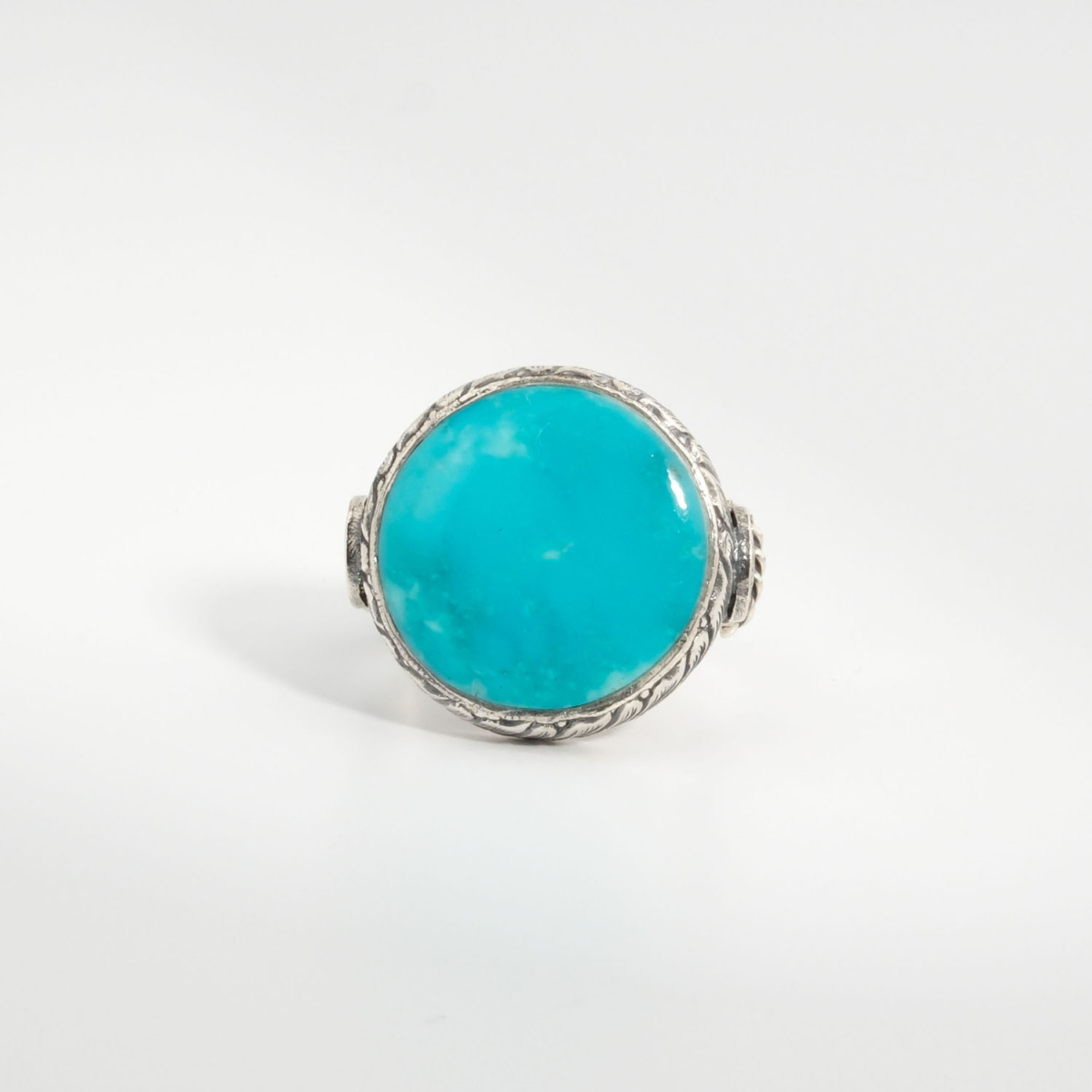 A 925 sterling silver handmade men's ring featuring a natural round cut Arizona blue turquoise gemstone.