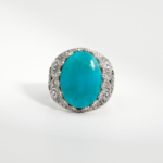 A 925 sterling silver handmade men's ring featuring a natural oval cabochon cut Arizona blue turquoise gemstone.