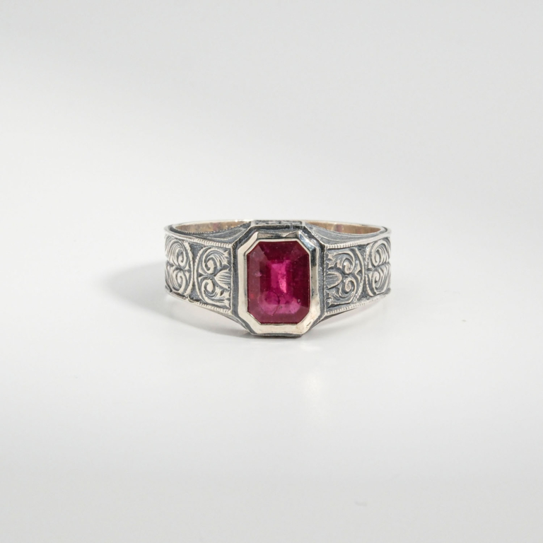 A 925 sterling silver handmade unisex ring featuring a natural rectangular cut red ruby gemstone.
