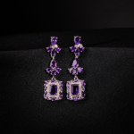 A pair of original amethyst natural stone 925 sterling silver dangle drop earrings featuring baguette and pear cuts.