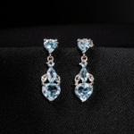 Kalp kesim orijinal blue topaz doğal taşlı 925 ayar gümüş sallantılı zirkon detaylı kadın küpe modeli.