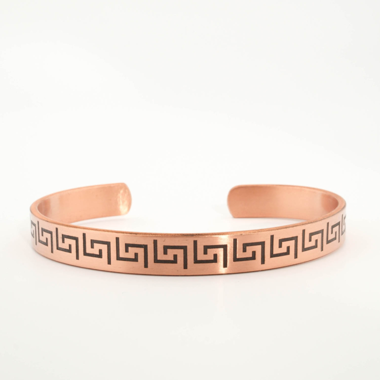A pure copper handmade open cuff bracelet featuring Greek key meander patterns on top and Ayat al-Kursi inside.