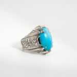 Bague pour homme faite main en argent 925 sertie d'une turquoise naturelle de Nishapur taillée en cabochon avec paires griffe.