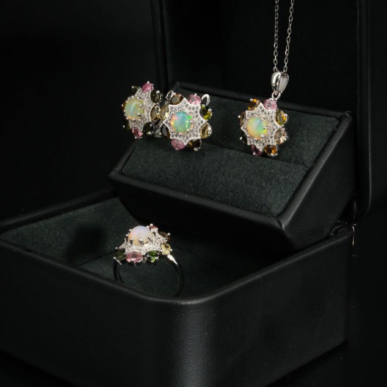 A natural rainbow cabochon opal and colorful tourmaline halo gemstone jewelry set in 925 sterling silver.